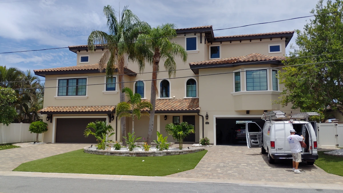A repainted single story home in Lakeland with white trim and a clean driveway